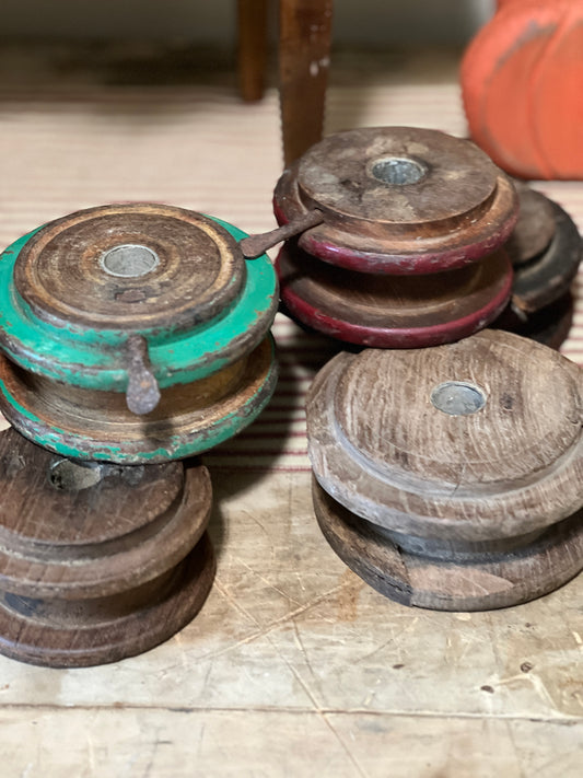 Vintage old wood pulley spools